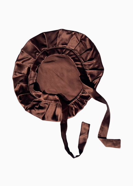 Brown silk bonnet on a white background